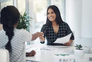 A jobseeker shaking hands with an employer.