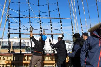 trainees working on a boat